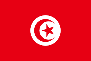 The flag of Tunisia has a red field. A white circle bearing a five-pointed red star within a fly-side facing red crescent is situated at the center of the field.